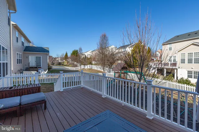 a view of a park with iron fence