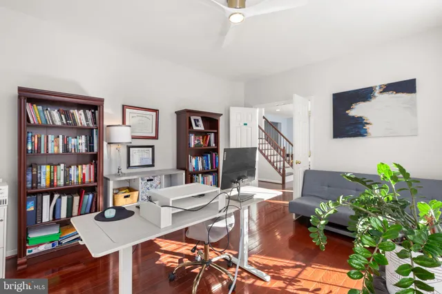 a bedroom with furniture and a wooden floor