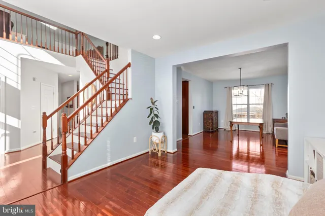a bedroom with furniture and a large window