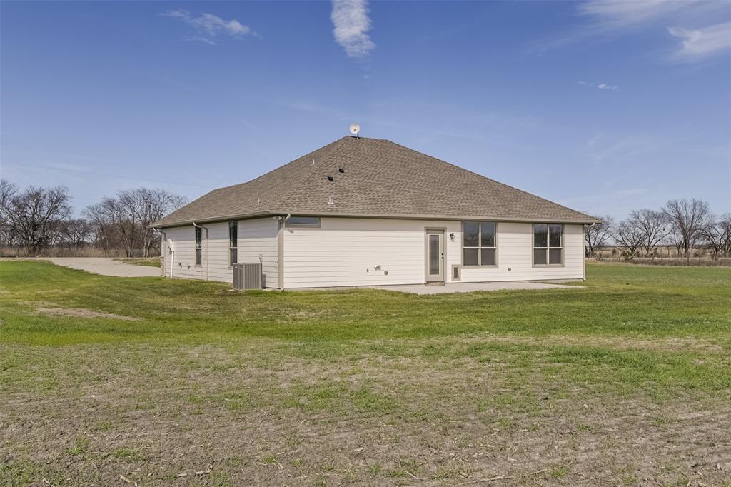 138 Zmolek Road Alma, TX 75119 - Photo 25 of 29 a front view of house with garden