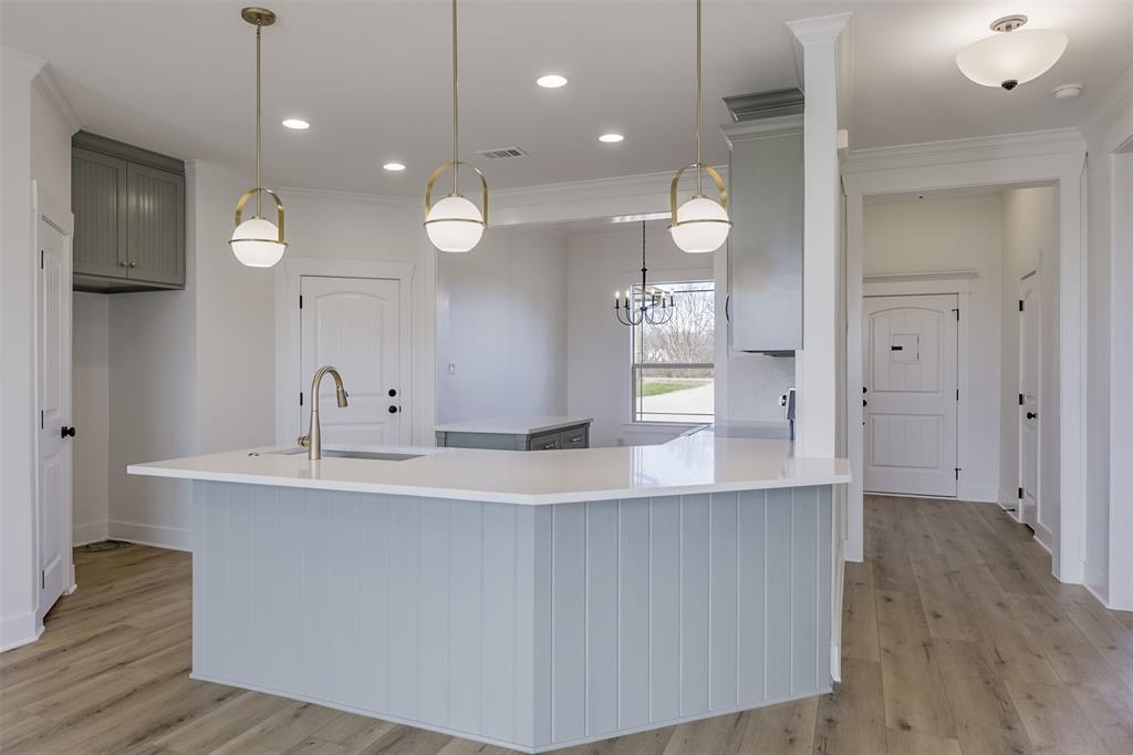 138 Zmolek Road Alma, TX 75119 - Photo 9 of 29 a bathroom with a sink a large mirror and vanity