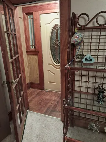 a bedroom with a bed and flat screen tv