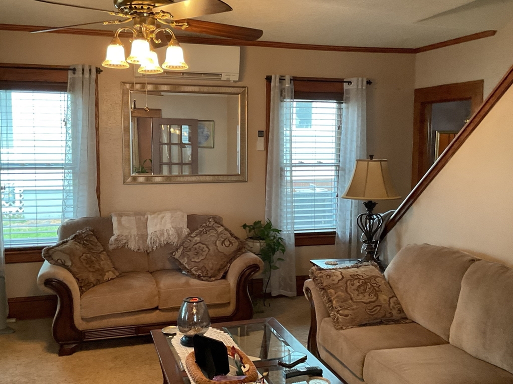 9 Montgomery Street Westfield, MA 01085 - Photo 9 of 29 a living room with furniture and a chandelier
