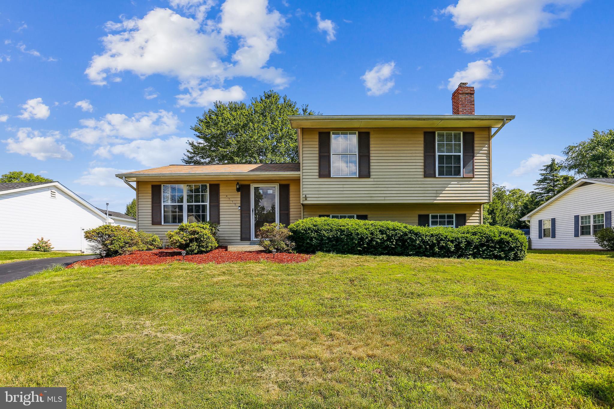 8225 Grainfield Road Severn, MD 21144 - Photo 1 of 35 a front view of a house with garden