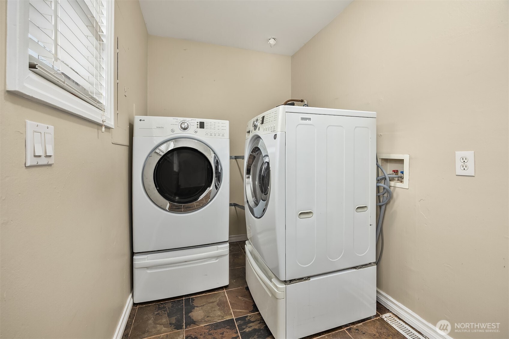 6741 34th Avenue Southwest Seattle, WA 98126 - Photo 12 of 25 a utility room with dryer and washer