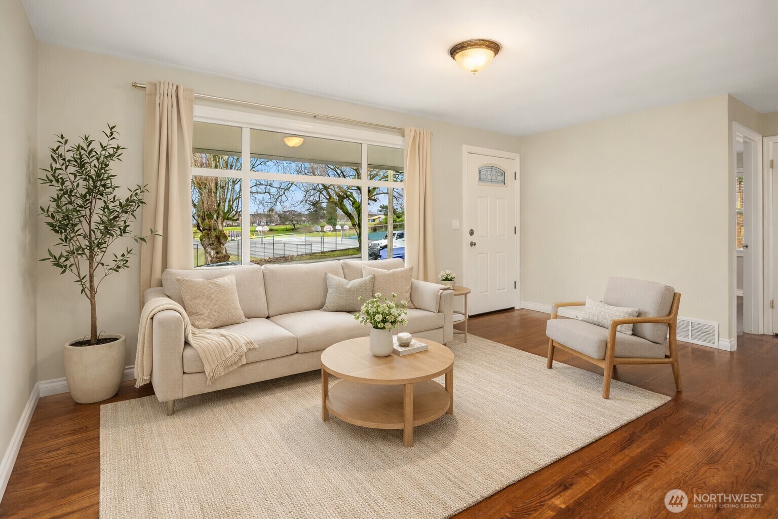 6741 34th Avenue Southwest Seattle, WA 98126 - Photo 2 of 25 a living room with furniture and a large window