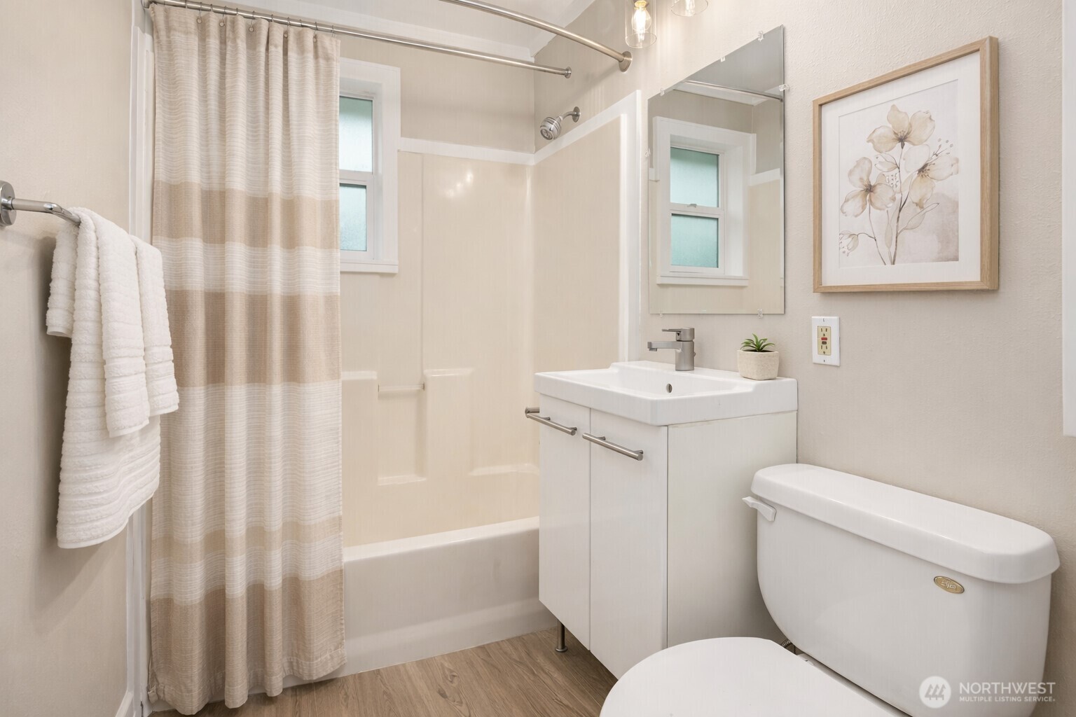 6741 34th Avenue Southwest Seattle, WA 98126 - Photo 7 of 25 a bathroom with a sink toilet and shower