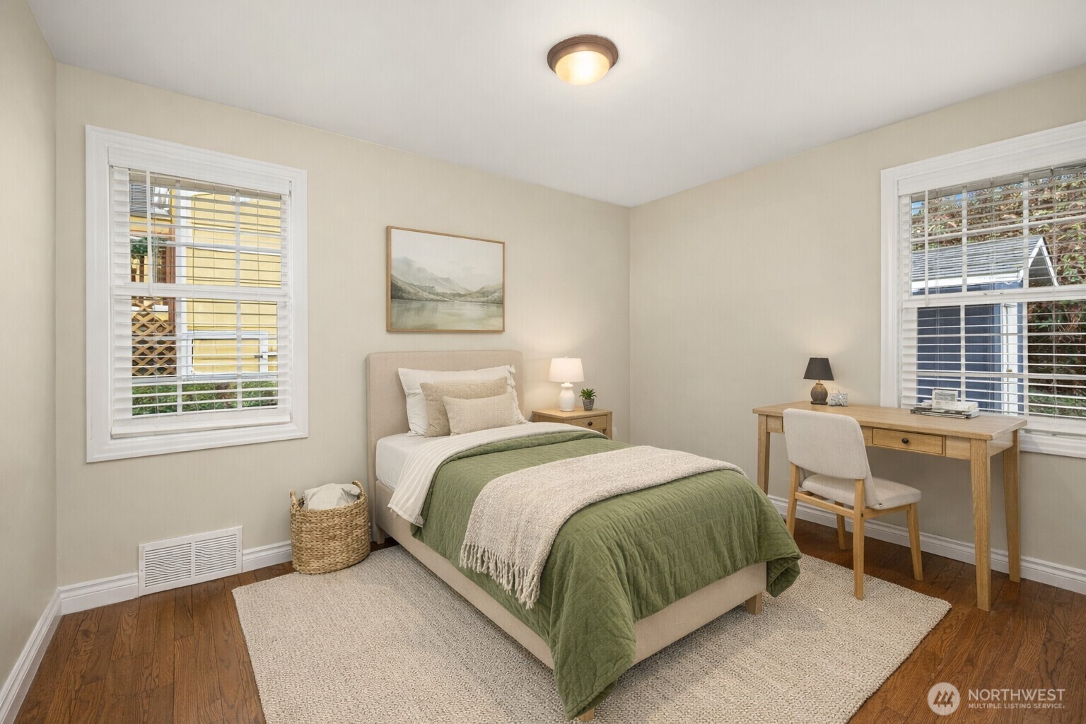 6741 34th Avenue Southwest Seattle, WA 98126 - Photo 8 of 25 a bedroom with a bed and a window