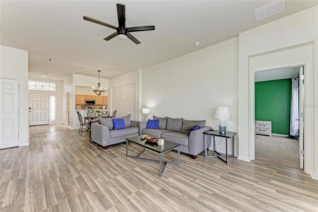 9950 52nd Street East Parrish, FL 34219 - Photo 16 of 48 a living room with furniture and a wooden floor