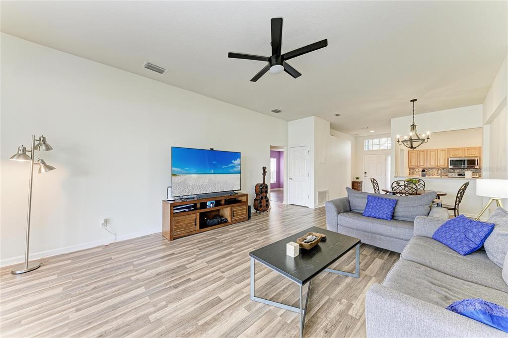 9950 52nd Street East Parrish, FL 34219 - Photo 17 of 48 a living room with furniture a window and a flat screen tv