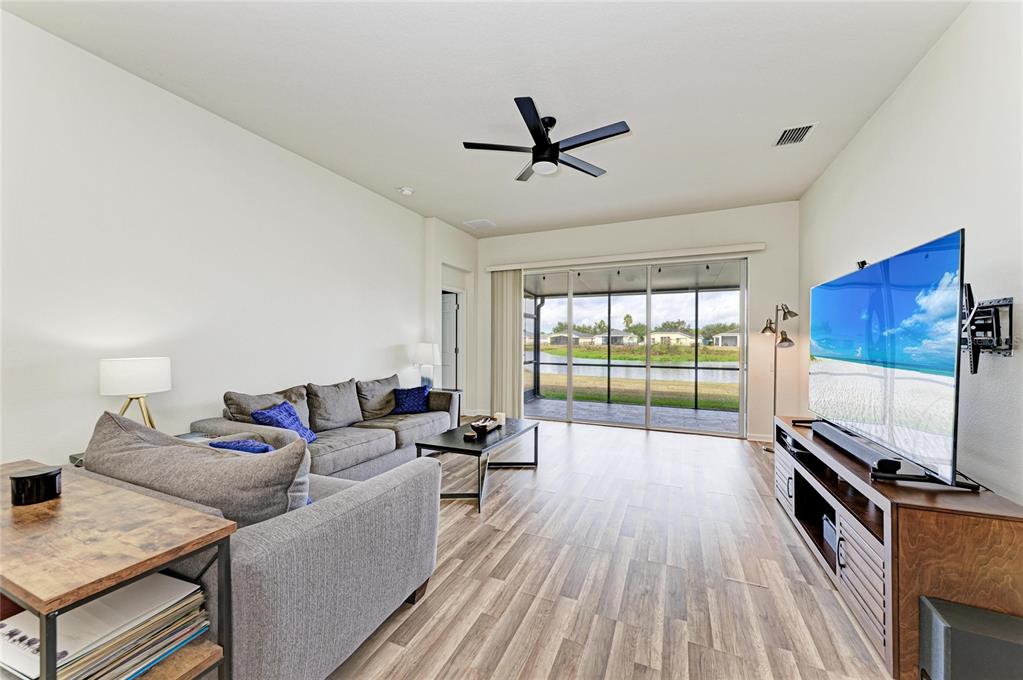 9950 52nd Street East Parrish, FL 34219 - Photo 18 of 48 a living room with furniture and a wooden floor
