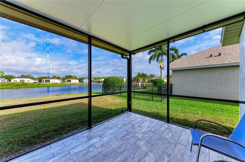 9950 52nd Street East Parrish, FL 34219 - Photo 21 of 48 a view of a porch with a yard