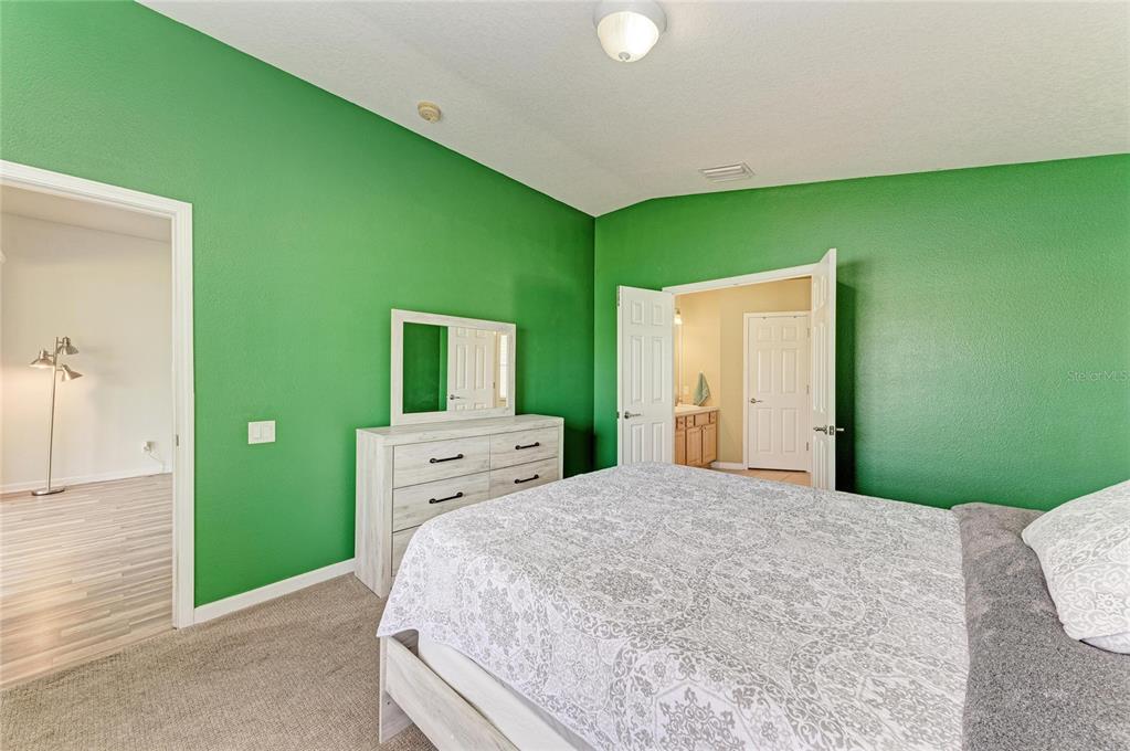 9950 52nd Street East Parrish, FL 34219 - Photo 26 of 48 a bedroom with a bed and a large window