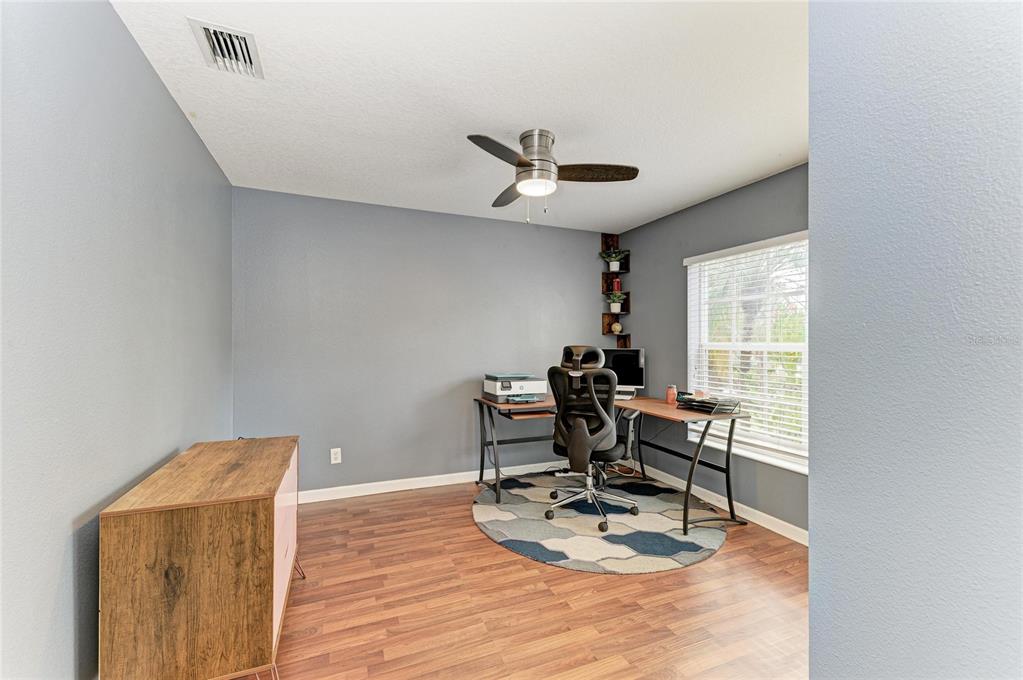 9950 52nd Street East Parrish, FL 34219 - Photo 29 of 48 a work room with furniture and wooden floor