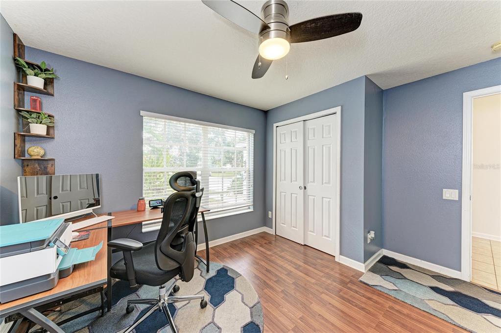 9950 52nd Street East Parrish, FL 34219 - Photo 30 of 48 a view of a workspace with furniture and a window