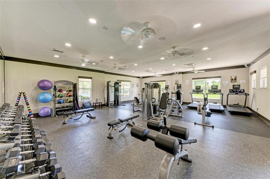 9950 52nd Street East Parrish, FL 34219 - Photo 37 of 48 a view of a room with gym equipment and a large window