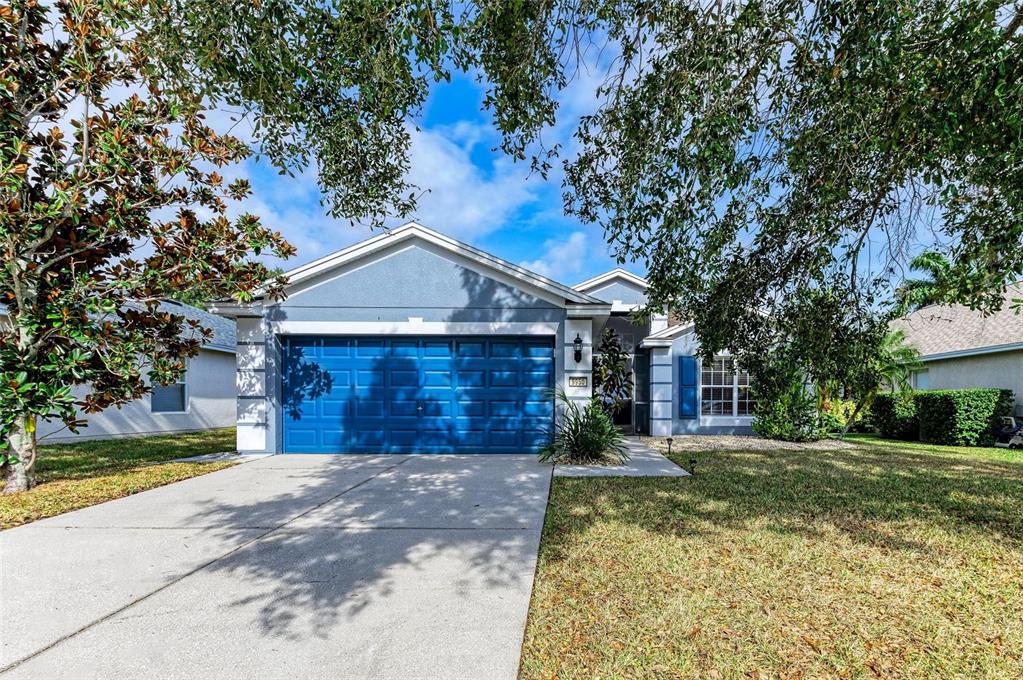 9950 52nd Street East Parrish, FL 34219 - Photo 4 of 48 a front view of a house with a yard