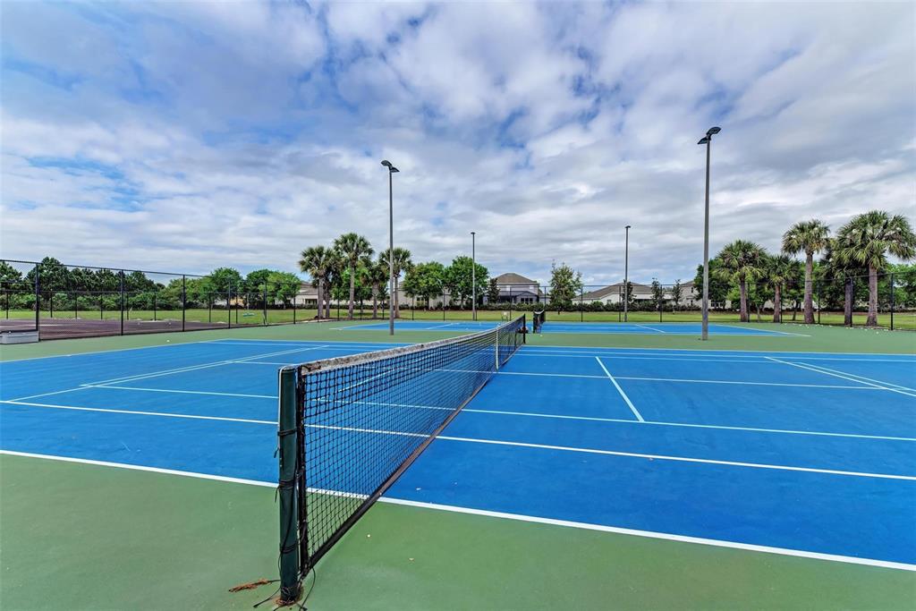 9950 52nd Street East Parrish, FL 34219 - Photo 45 of 48 a view of an outdoor space and tennis court
