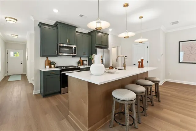 a kitchen with a table and chairs in it