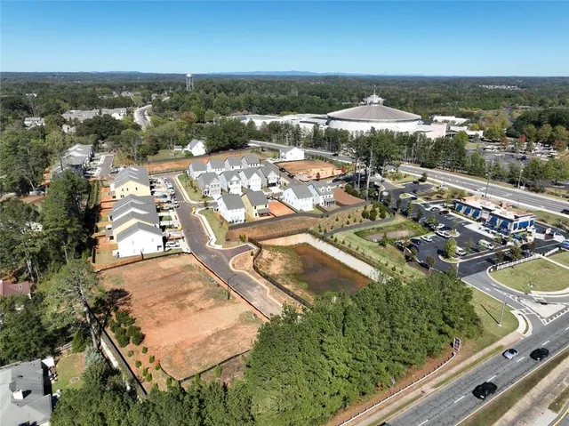 an aerial view of residential houses with outdoor space