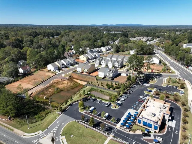 an aerial view of residential houses with outdoor space