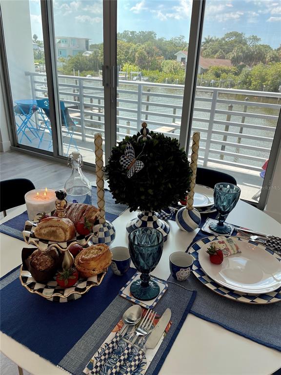 1709 North Tamiami Trail, Unit 213 Sarasota, FL 34234 - Photo 16 of 49 a room with furniture and a large window