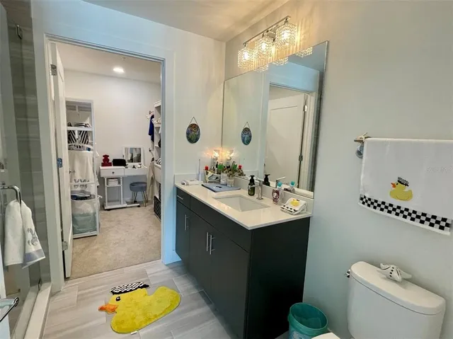 a table with a vase and a chandelier