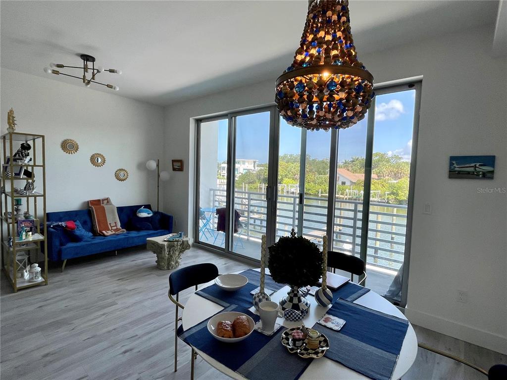 1709 North Tamiami Trail, Unit 213 Sarasota, FL 34234 - Photo 20 of 49 a living room with furniture and floor to ceiling window