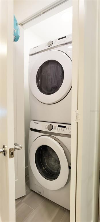 1709 North Tamiami Trail, Unit 213 Sarasota, FL 34234 - Photo 30 of 49 a utility room with dryer and washer