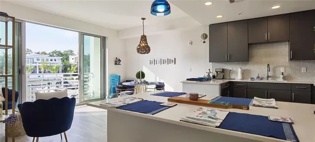 a room with furniture a chandelier and a window