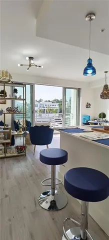 a kitchen with stainless steel appliances a refrigerator sink and stove
