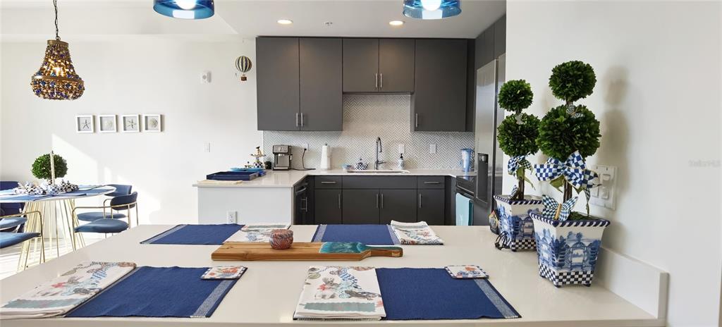 1709 North Tamiami Trail, Unit 213 Sarasota, FL 34234 - Photo 40 of 49 a kitchen with a refrigerator and a stove