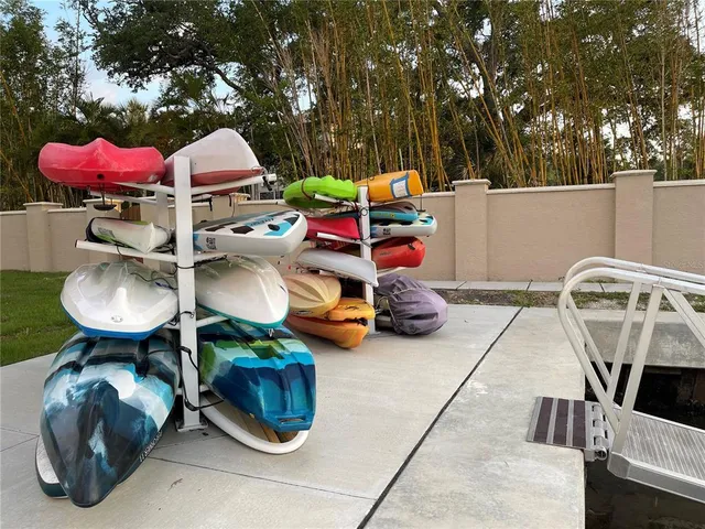a view of a swimming pool with a patio and a yard