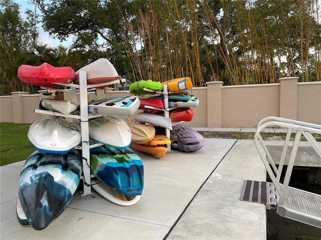 1709 North Tamiami Trail, Unit 213 Sarasota, FL 34234 - Photo 41 of 49 a car parked in front of a house with yard