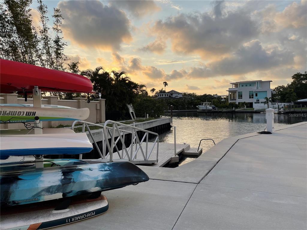 1709 North Tamiami Trail, Unit 213 Sarasota, FL 34234 - Photo 42 of 49 a view of a swimming pool with a patio and a yard