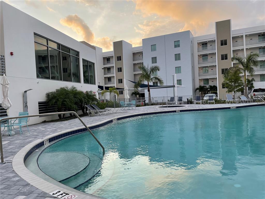 1709 North Tamiami Trail, Unit 213 Sarasota, FL 34234 - Photo 6 of 49 a view of a swimming pool with a patio