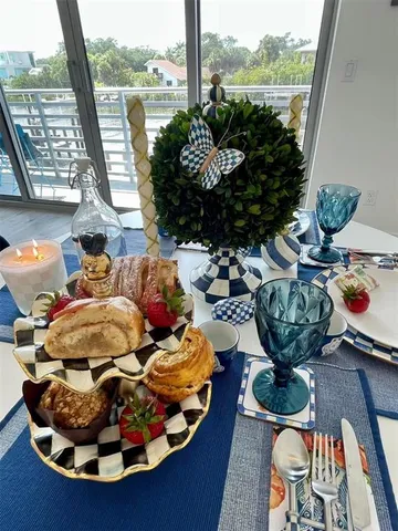 a view of a balcony dining table and chairs