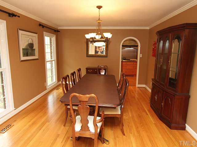 8644 Valley Brook Drive Raleigh, NC 27613 - Photo 5 of 18 DINING ROOM: Spacious room with gleaming hardwood floors and arched doorway to the kitchen with a pocket door!