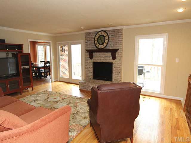 8644 Valley Brook Drive Raleigh, NC 27613 - Photo 6 of 18 FAMILY ROOM: Freshly painted and newer windows throughout the home too! Beautiful painted fireplace and hand-carved wood mantel!