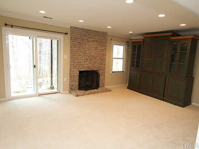 8644 Valley Brook Drive Raleigh, NC 27613 - Photo 10 of 18 Great family room with Masonry Fireplace and gas logs! New carpet, canned lighting and freshly painted! The room opens to a brick patio and then leads down to another patio! Great indoor and outdoor living space in this home!