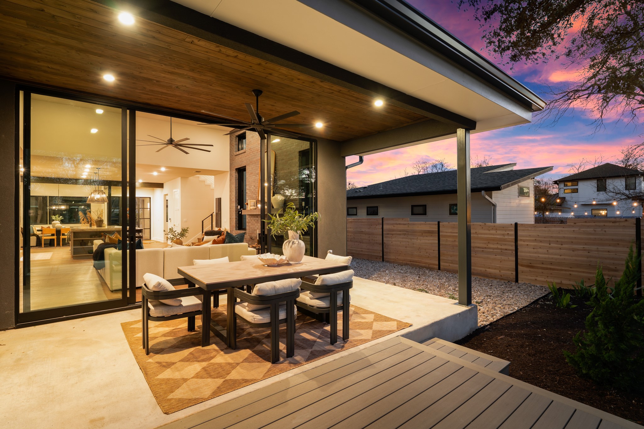 7706 Rutgers Avenue Austin, TX 78757 - Photo 22 of 35 Deck at dusk featuring a patio, outdoor dining space, and a ceiling fan