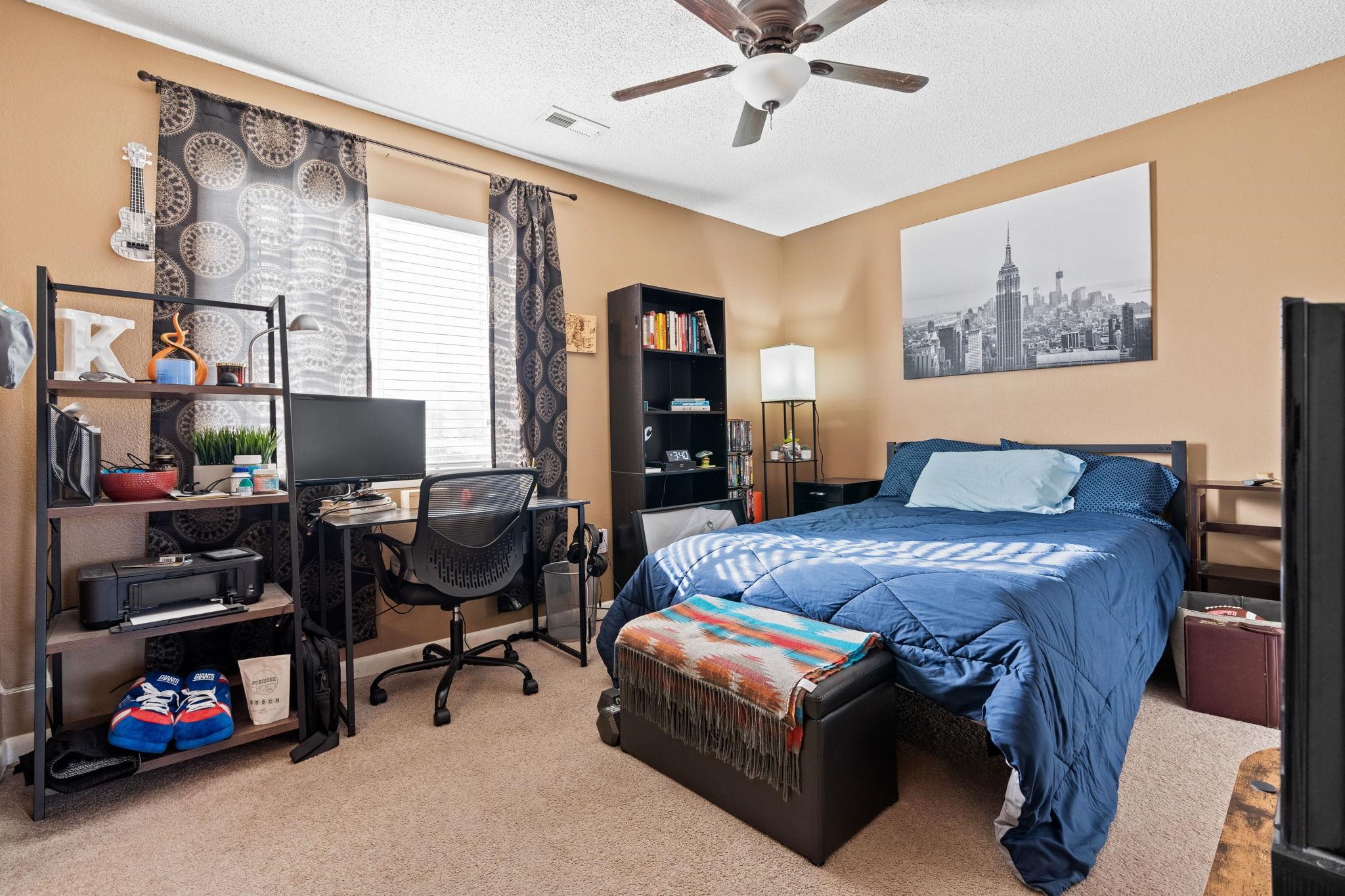 220 Myrtle Greens Drive, Unit I Conway, SC 29526 - Photo 15 of 30 Bedroom with carpet, a desk, a textured ceiling, and ceiling fan