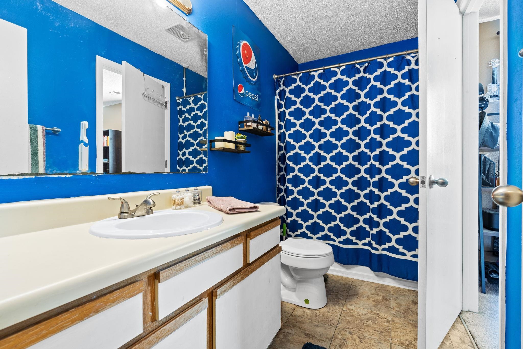 220 Myrtle Greens Drive, Unit I Conway, SC 29526 - Photo 17 of 30 Full bathroom with a shower with shower curtain, a textured ceiling, and vanity