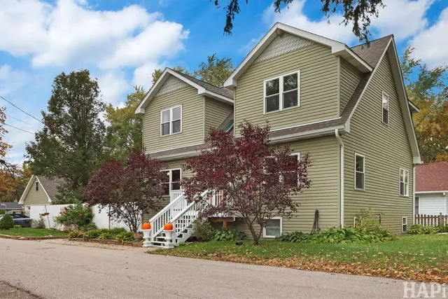 a small white house with a outdoor space