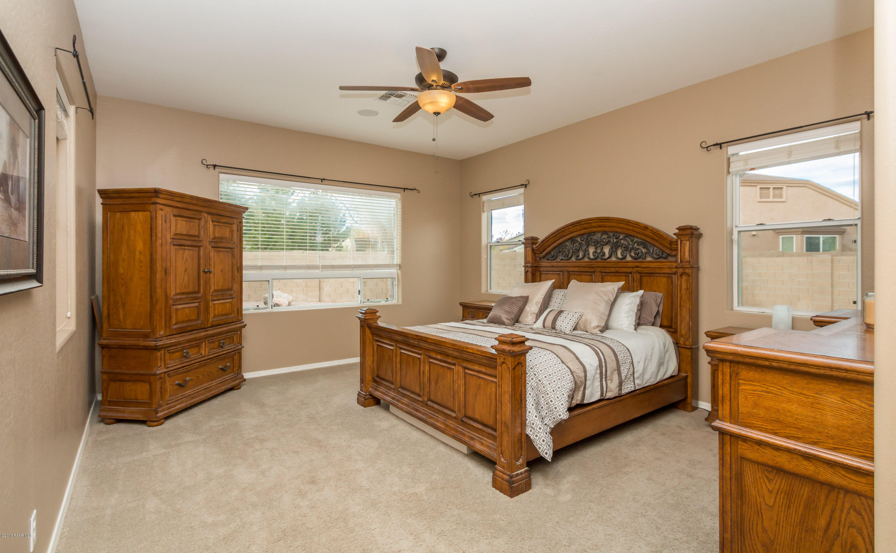 7887 East Mesteno Road Prescott Valley, AZ 86315 - Photo 13 of 30 a bedroom with a bed and window