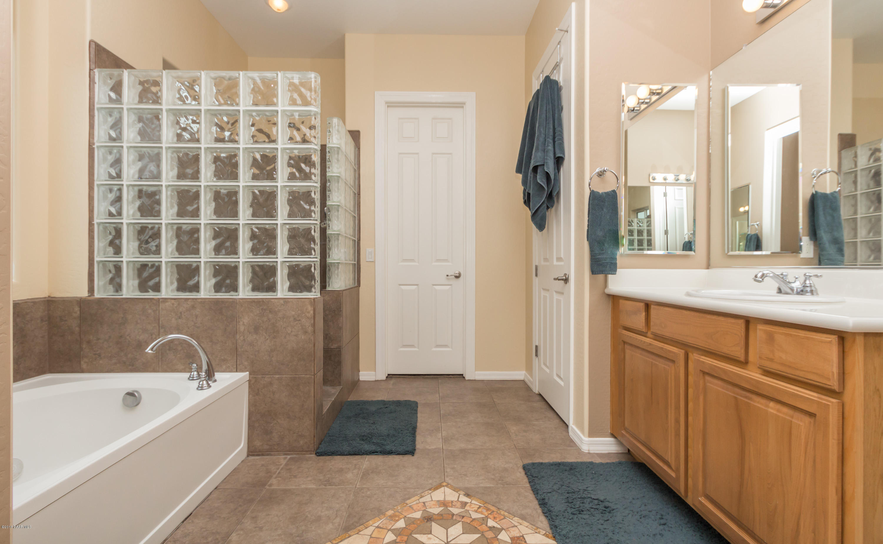 7887 East Mesteno Road Prescott Valley, AZ 86315 - Photo 14 of 30 a bathroom with a tub sink and a mirror