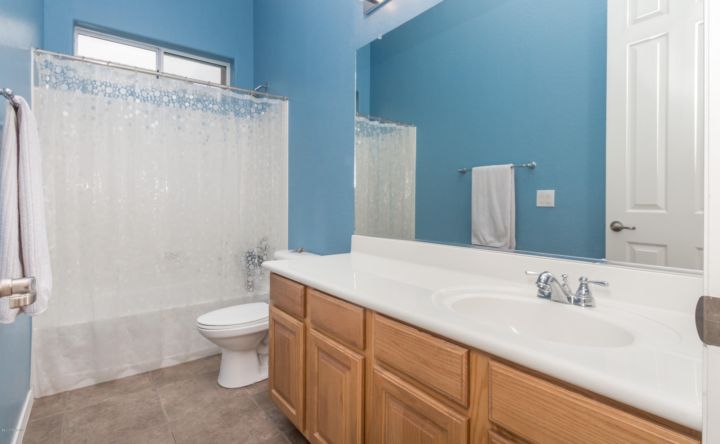 7887 East Mesteno Road Prescott Valley, AZ 86315 - Photo 16 of 30 a bathroom with a sink toilet and shower