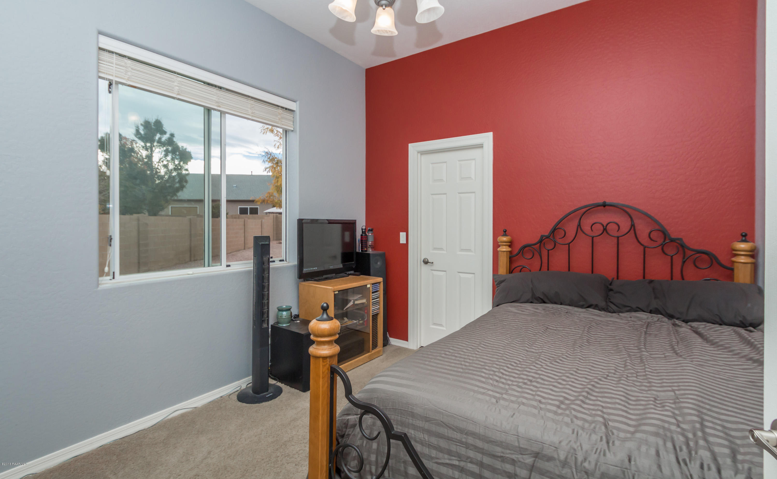 7887 East Mesteno Road Prescott Valley, AZ 86315 - Photo 17 of 30 a bedroom with a bed and a window