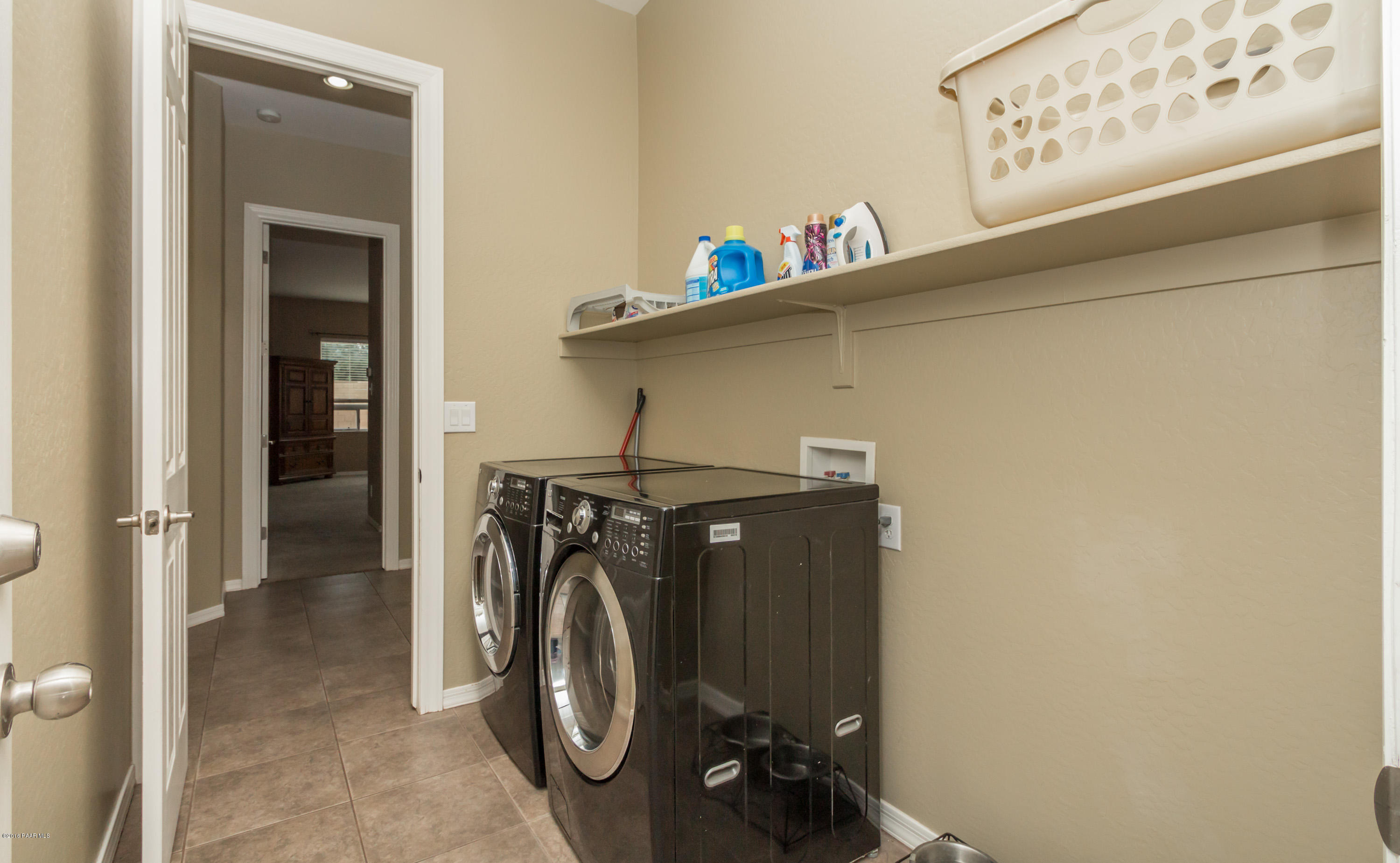 7887 East Mesteno Road Prescott Valley, AZ 86315 - Photo 21 of 30 a utility room with dryer and washer