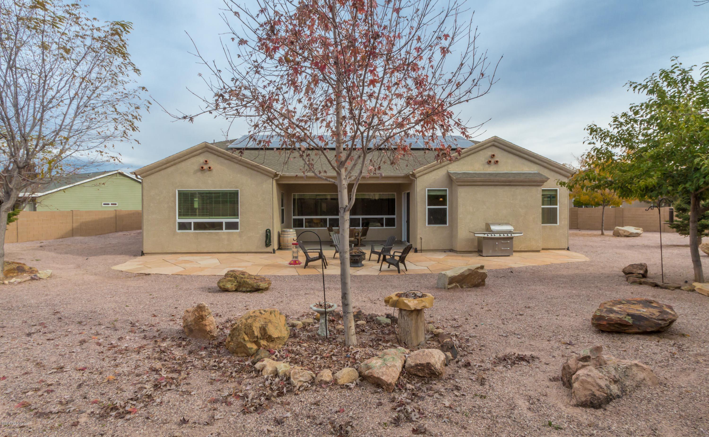 7887 East Mesteno Road Prescott Valley, AZ 86315 - Photo 25 of 30 a front view of a house with yard and seating area